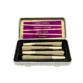 Open yellow pattern box with inner label containing rosin infused pre-rolls. Packaged as a Flight Pack.